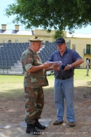 Major Charles de Cruz shows the program notes to Andrew Schofield who will be making a DVD of the 2012 Tattoo