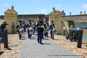 The Het Historisch Tamboerkorps van der Koninklijke Marechaussee from the Netherlands march through the Lions Gate