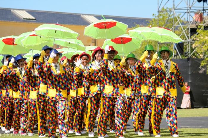 The Cape Town Entertainers in their colourful minstrel costumes, twirling umbrellas and glittering hats